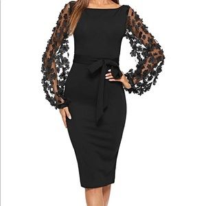 Beautiful black bodycon dress with statement sleeve and  lace appliqué